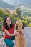 A woman walks shepherd dog photo