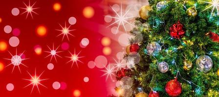 Christmas Tree In Bokeh and blur Background. Ornament And Abstract Defocused Lights. Concept Christmas Day, happy, highlights, holiday, light, merry, new year, night, season 2023. Copy space on left. photo