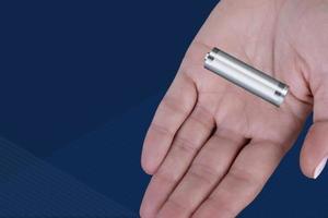 Battery in a woman's palm. Disposal and recycling of lithium-ion batteries, alkaline batteries. Copy space. photo