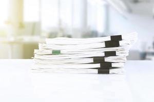 stack of reporting paper documents on a business table in the office, business documents for annual reports. Business analytics. Business office concept, soft focus. photo