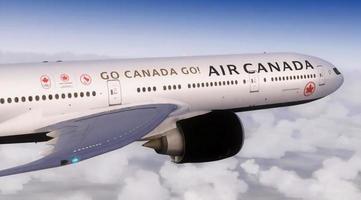 Montreal, Canada, December 15, 2021 - Air Canada Boeing 777. The plane flies in the sky above the clouds. photo