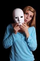 woman taking off mask photo