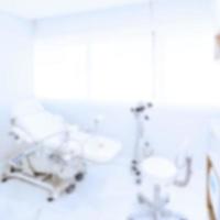 Gynecological chair with modern colposcope in the clinic. Inside view. Soft blurred background. photo