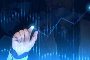 Stock market growth graph, forex manipulation, the hand of a man businessman points to the neon point of growth and profit, double exposure. photo