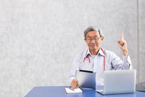 Chinese doctor using computer tablet with figured out thinking find a solution to anti virus found something and creativity action. photo