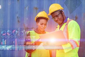 worker with technology for helping work logistic control loading tracking containers at port cargo to trucks for export and import goods around the world concept. photo