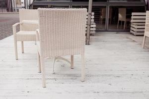 wicker chair in a outdoor cafe. photo