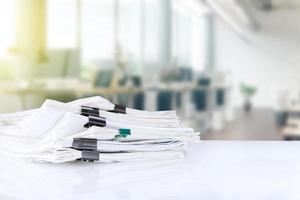 stack of reporting paper documents on a business table in the office, business documents for annual reports. Business analytics. Business office concept, soft focus. photo