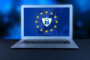 Lock icon and shield icon on the background of the EU flag, on the laptop screen. GDPR, General Data Protection Regulation, European Data Privacy Act. Copy space. photo