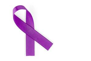 Purple ribbon, symbol of social awareness, isolated on white background, top view. World Cancer Day. copy space. photo