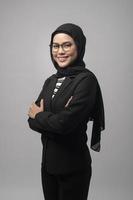 Beautiful muslim woman wearing glasses over white background studio photo