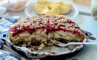 Apple pie topped with cranberry jam. photo