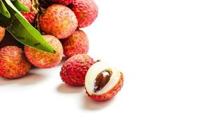 Fresh lychee fruits Litchi with leaves isolated on white background photo