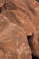 Brown mountain sandstone with large chunks of patterns, designed to be like nature by heavy machinery, beautifully crafted in a vast lakeside garden, perfect for relaxing and watching nature in summer photo