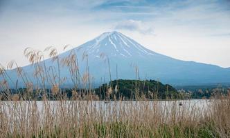 Beautiful Fuji mountain with cloud and blue sky in summer, the famous landmark and attraction place of tourists who have a long holiday in Japan, Lake Kawaguchiko photo