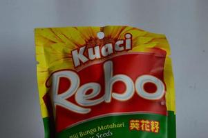 Batam, Indonesia. June 4, 2022. Kuaci, sunflower seed snack with green tea flavor. kuaci seeds from brand rebo photo