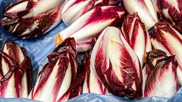 chicory salad fresh Belgian endive or chicory and red Radicchio vegetables fresh ripe fruit counter in the market shop healthy meal food diet snack veggie vegan photo