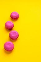 Bright colorful macaroons background. Sweet food stylish flat lay wallpaper. photo