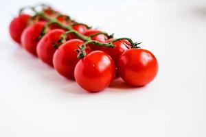 Fresh organic bunch of cherry tomatoes. photo