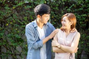 Beautiful portrait couple looking each others eyes and smiling with happy, young asian man and woman relation with love dating, husband and wife feeling and emotion, lovers and lifestyle concept. photo