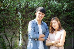 Beautiful portrait couple looking each others eyes and smiling with happy, young asian man and woman relation with love dating, husband and wife feeling and emotion, lovers and lifestyle concept. photo
