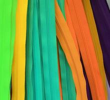 Detailed close up view on samples of cloth and fabrics in different colors found at a fabrics market photo