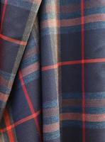Detailed close up view on samples of cloth and fabrics in different colors found at a fabrics market photo