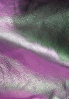 Detailed close up view on samples of cloth and fabrics in different colors found at a fabrics market photo