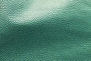 Detailed close up view on samples of cloth and fabrics in different colors found at a fabrics market photo