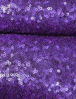 Detailed close up view on samples of cloth and fabrics in different colors found at a fabrics market photo