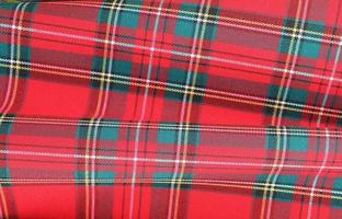 Detailed close up view on samples of cloth and fabrics in different colors found at a fabrics market photo