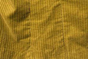 Detailed close up view on samples of cloth and fabrics in different colors found at a fabrics market photo
