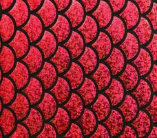 Detailed close up view on samples of cloth and fabrics in different colors found at a fabrics market photo