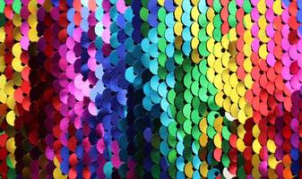 Detailed close up view on samples of cloth and fabrics in different colors found at a fabrics market photo