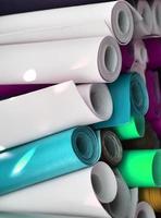 Detailed close up view on samples of cloth and fabrics in different colors found at a fabrics market photo