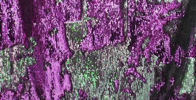 Detailed close up view on samples of cloth and fabrics in different colors found at a fabrics market photo