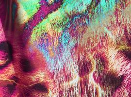 Detailed close up view on samples of cloth and fabrics in different colors found at a fabrics market photo