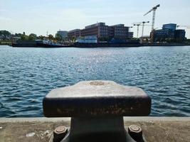 Different bollards in front of the water at the port of kiel. photo