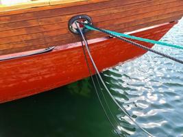 Detailed close up detail of ropes and cordage in the rigging of an old wooden vintage sailboat photo