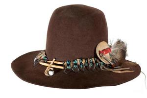 Native American hat with hat band made of raptor claws and turquoise on brown felt with eagle feather photo