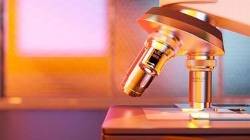 Microscope on table beside window, close-up shot and orange light onto work area. photo