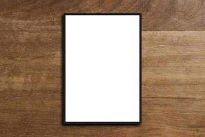 Mock up blank poster picture frame on wood wall photo