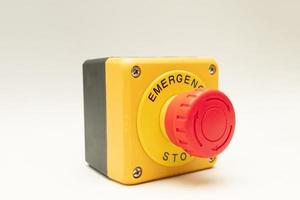 Stop Button and the Hand of Worker About to Press it. emergency stop button. Big Red emergency button or stop button for manual pressing. photo
