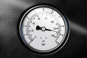 Round temperature gauge isolated on a black panel. Circular barometer or indicator template. 3d illustration photo