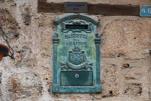 Side Turkey  February 20 2022 close-up of a blue metallic antique mailbox on a stone building photo