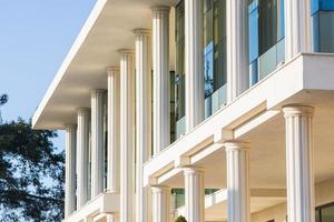 Close-up of a white stone building with columns photo