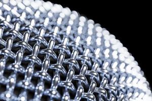 3d illustration close-up of a metal microphone on a black background photo