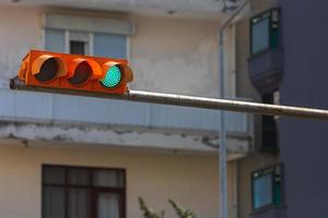 Traffic lights over urban intersection. Green light photo