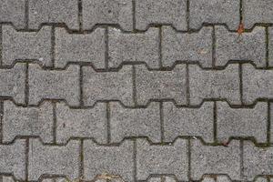 The pavement of granite cobblestones. Old city road photo