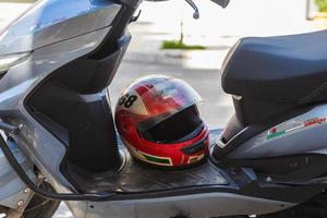 Side Turkey  February 20 2022 close-up of a red racing helmet on a motorcycle saddle photo